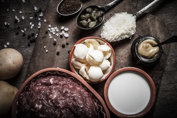 Set of ingredients for cooking on old wooden background. Toned — Stock Photo, Image