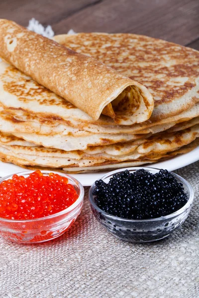 Russian pancakes - blini with red and black caviar. Selective fo — Stock Photo, Image