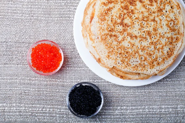 Russian pancakes - blini with red and black caviar — Stock Photo, Image