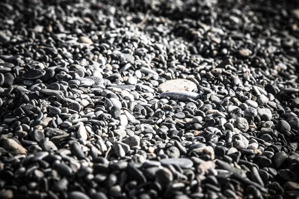 El fondo del guijarro natural en la costa marina. Enfoque selectivo. Para — Foto de Stock