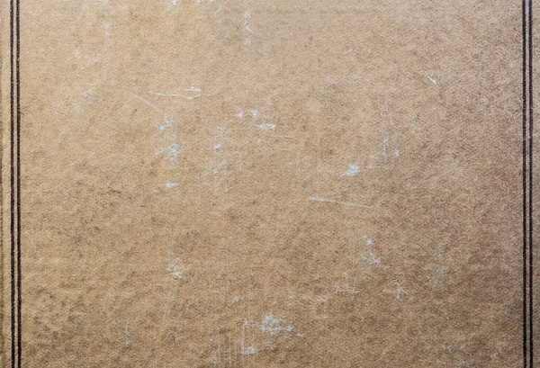 누르스름 한 종이 갈색 마분지 골판으로 된 골조로 된 빈티지 배경이 역반 문체로 된 오래 된 스테인드 북을 덮고 있다 — 스톡 사진