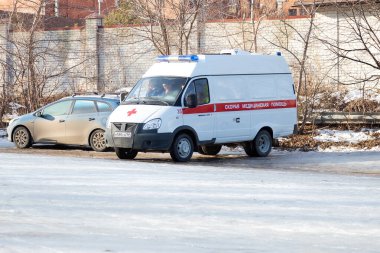 Saratov, Russia - 02.29.2020: Russian ambulance car stands on the street on ice in winter.