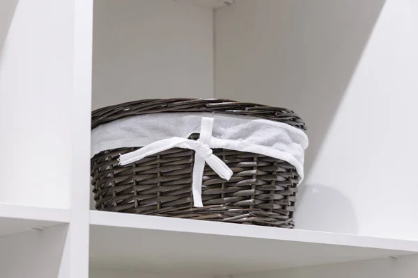 Organization of home space, order, cleanliness and comfort. Household goods storage equipment. Box baskets are woven fabric from trendy natural eco-friendly materials. Interior decor element. — Stock Photo, Image