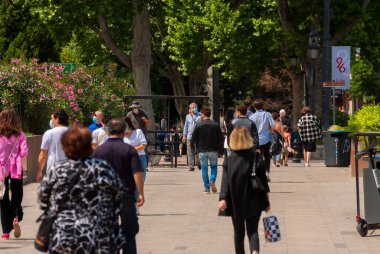 Georgia, Tbilisi - May 23, 2021: Crowd of anonymous people walking on busy city street.