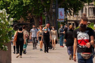 Georgia, Tbilisi - May 23, 2021: Crowd of anonymous people walking on busy city street.