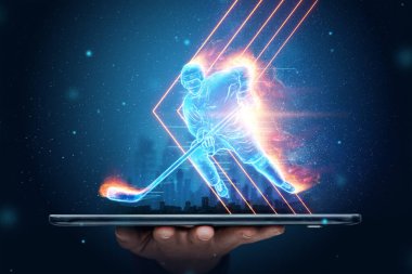 İnternette spor yayını, akıllı telefondan hokey oyuncusunun hologramının silüeti. Spor konsepti, hız, oranlar