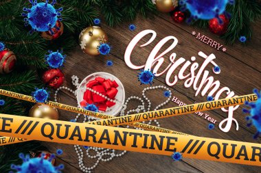 Kendini izole etme, evde tatil, üzerinde karantina ve uçan virüsler yazan sarı bir kurdelenin altında Noel arkaplanı. salgın, covid-19