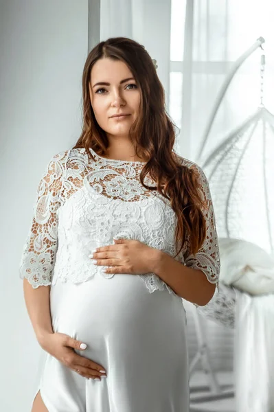 Pregnant Girl White Clothes Stands Light Background Beautiful Belly Young — Stock Photo, Image