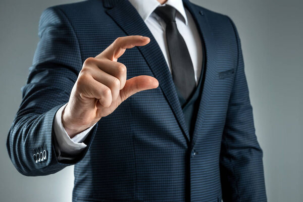 A man in a suit hands close-up shows a virtual business card. mockup, layout. Concept for networking, business dating, important connections. Shot on a gray background