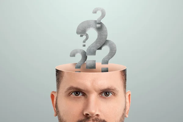 the male head is open instead of the brain with question marks. Creative background, concept of problem solving, searching for an answer, task, thinking