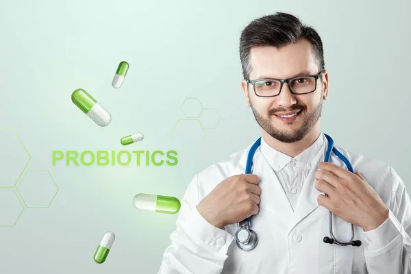 Doctor and lettering probiotics and pills image. The concept of diet, intestinal microflora, microorganisms, healthy digestion