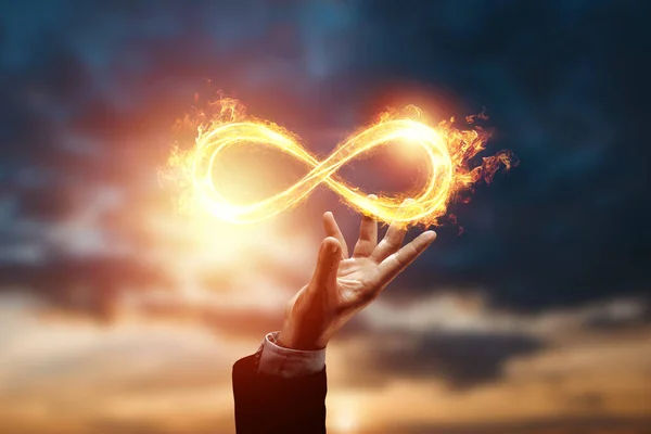 Infinity Fire Sign Hand Businessman Sunset Backgroun — Stock Photo, Image