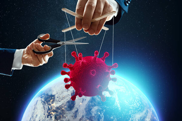 Male puppeteer hand thread coronavirus on the background of the earth. The concept of shadow government, world conspiracy, manipulation, control