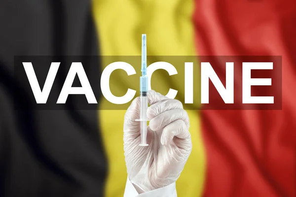 Siringa Con Vaccino Mano Sullo Sfondo Della Bandiera Del Belgio — Foto Stock