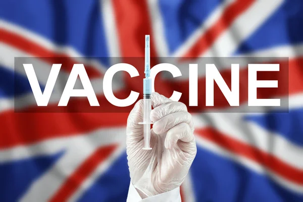 Una Jeringa Con Una Vacuna Mano Del Médico Fondo Bandera — Foto de Stock