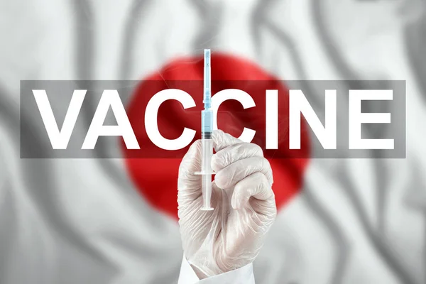 Siringa Con Vaccino Mano Sullo Sfondo Della Bandiera Del Giappone — Foto Stock