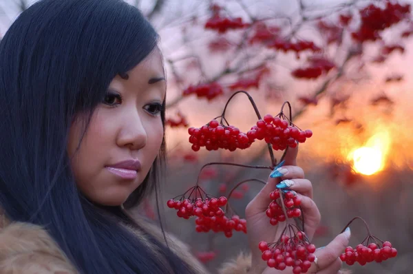 Beautiful woman look on berry — Stock Photo, Image