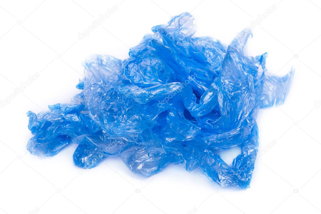 Heap of of blue shoe covers isolated on white background
