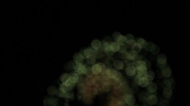 Fireworks uygulamasıyla bokeh. Yeşil ve kırmızı büyük top.