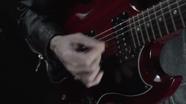 Close up of rock musician plays red electric guitar on concert. — Stock Video