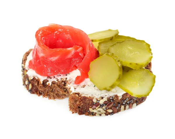 Small sandwich with salmon and canned cucumber — Stock Photo, Image