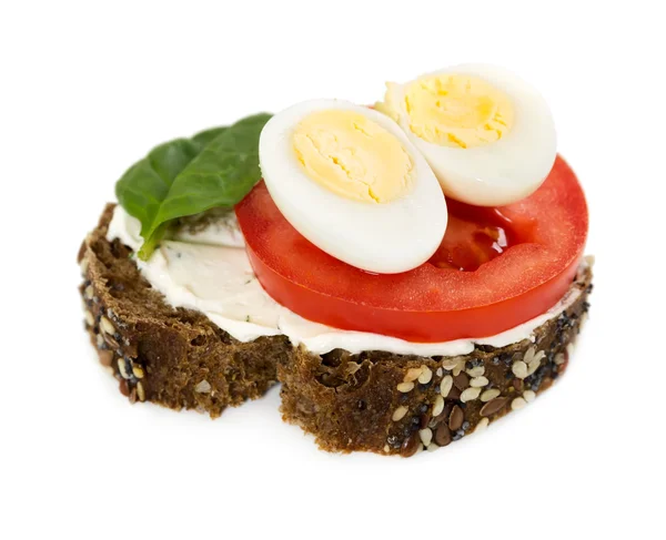 Small sandwich with spinach, tomato and quail eggs — Stock Photo, Image