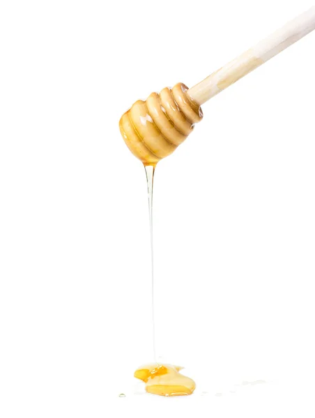 Palillo de miel con miel fluida —  Fotos de Stock