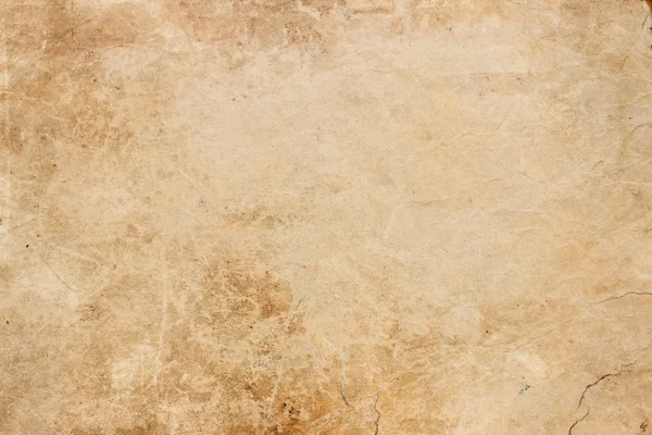 Texture of old paper with scratches and dirty spots 