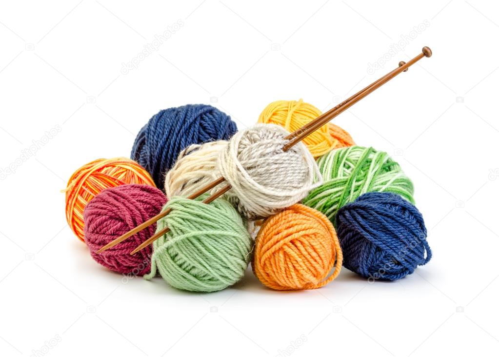Colorful balls of yarn and wooden needles 