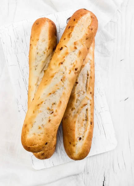 French baguettes on wooden background — Stock Photo, Image