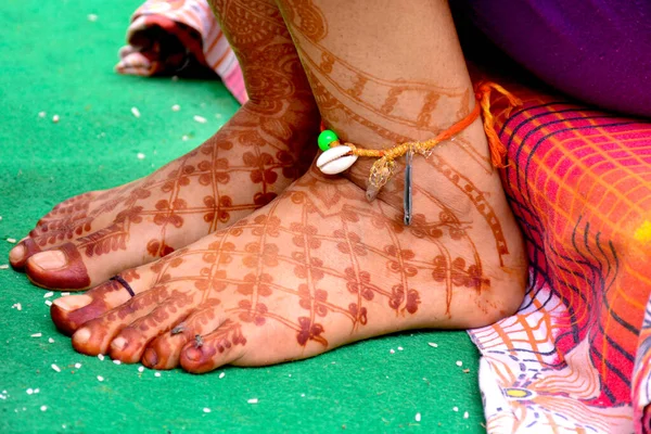 Pakistani Indian Bridal showing foot mehndi design on wedding ceremony