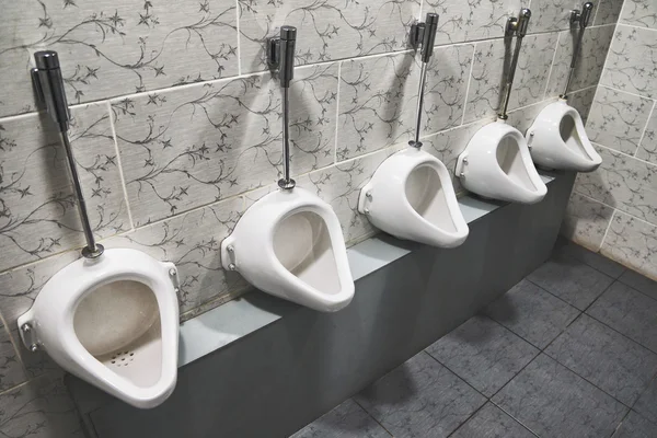 Porcelain urinals — Stock Photo, Image