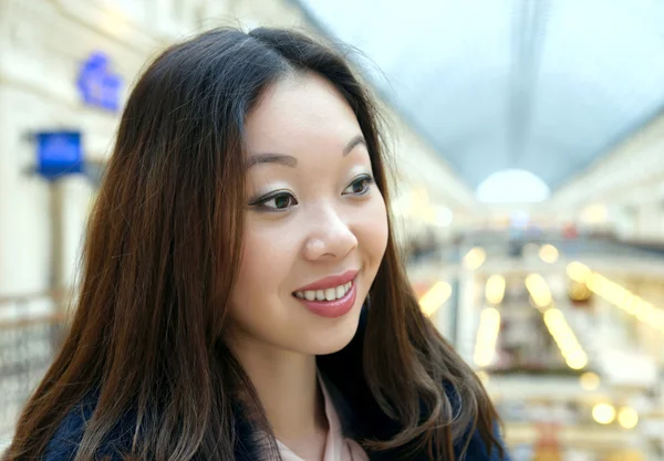 Beautiful Korean girl smiles shyly. — Stock Photo, Image