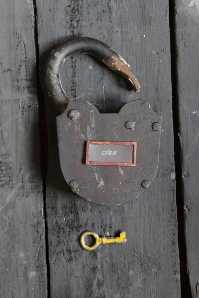 Open sign and old padlock — Stock Photo, Image