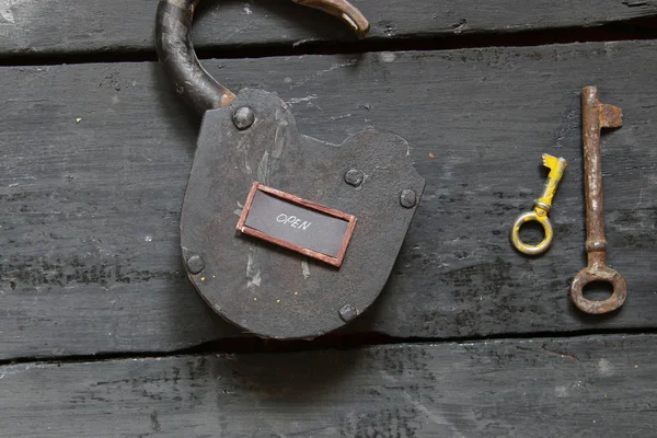 Open sign and old padlock — Stock Photo, Image