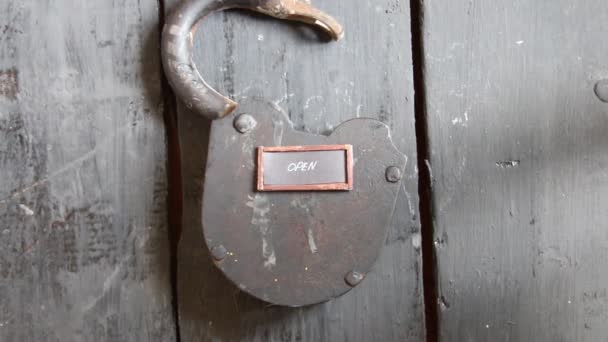 Open sign and old padlock — Stock Video