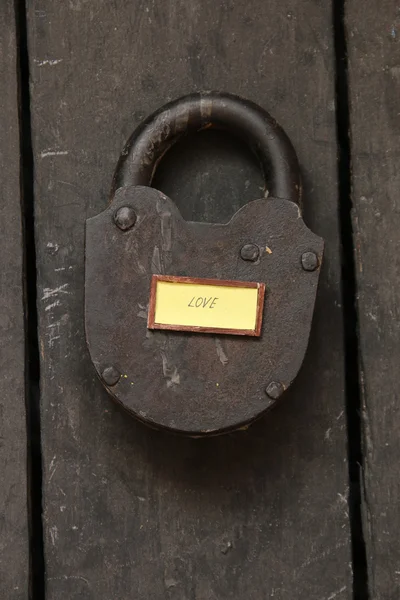 Love text and old padlock — Stock Photo, Image