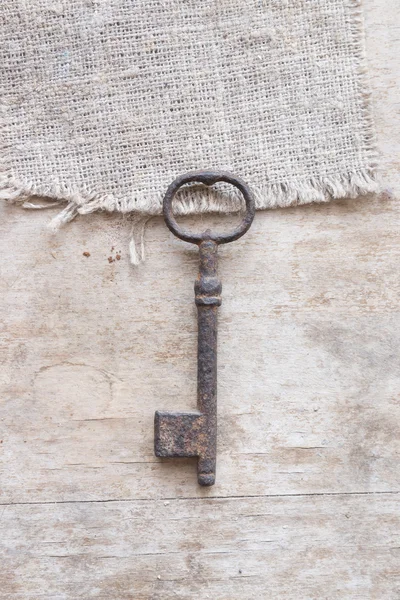 Rusty key on the table — Stock Photo, Image