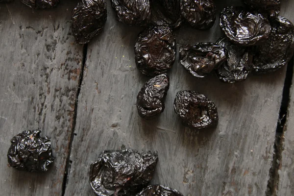 Prunes on a dark background — Stock Photo, Image