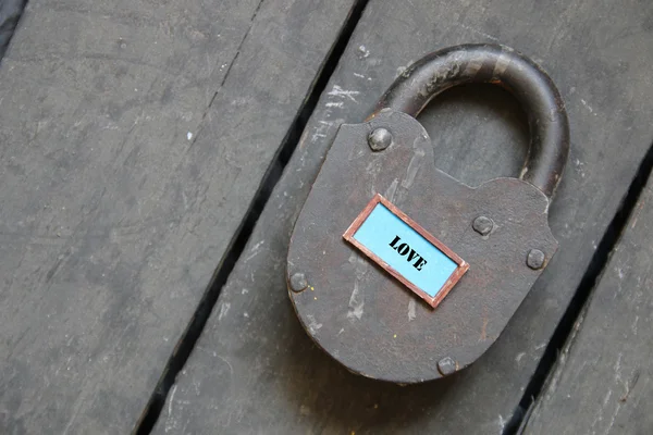 Love - inscription on the old padlock — Stock Photo, Image