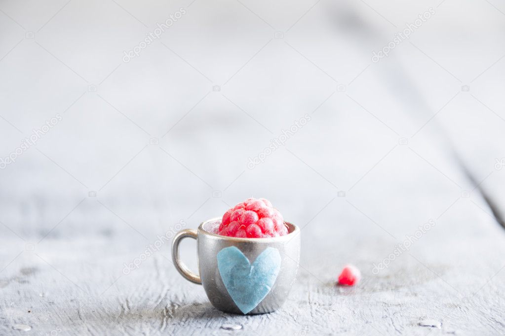 ripe raspberry in a cup with heart, Valentines Day card