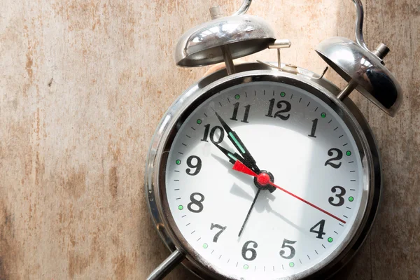 Retro alarm clock on a table — Stock Photo, Image