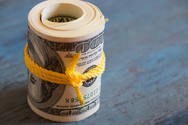 Dollars on blue wooden table — Stock Photo, Image