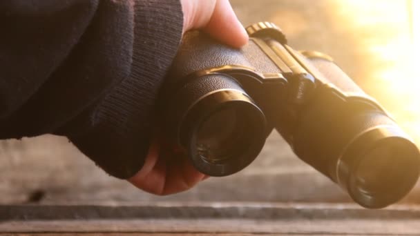 Vision word on binoculars. Sunset. — Stock Video