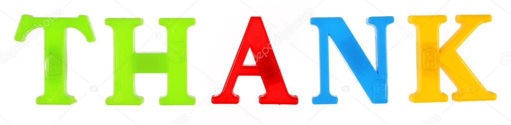 The word thenk is lined with multi-colored plastic letters, white background, isolate.