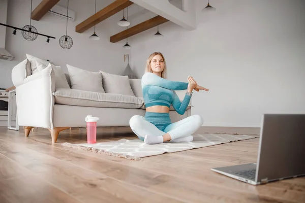 Fitness woman blogger recording video on camera, training home in living room. Concept Lifestyle influencer sport and recreation