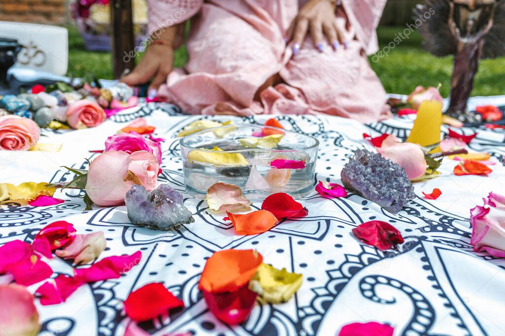 Latin woman with amethyst stones and healing crystals in water for holistic therapy in Latin America