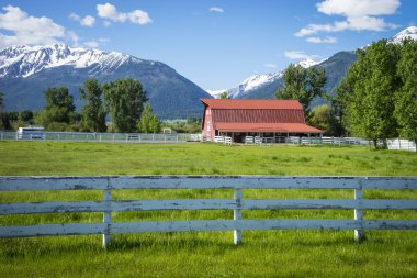 White fence and red barn, in Oregon clipart