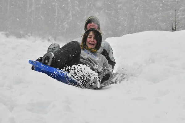 Sledding on a saucer — Stock Photo, Image