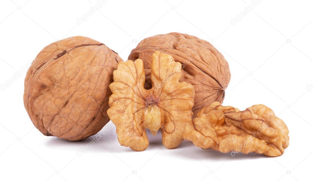 wallnut and a cracked walnut isolated on the white background